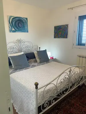 Letto o letti in una camera di Villa Bella