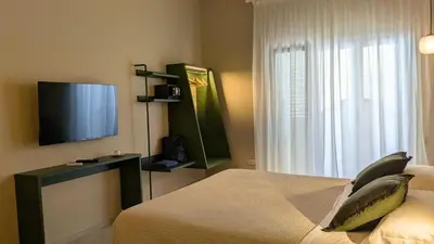 TV o dispositivi per l'intrattenimento presso PalazzoRusso Ortigia Suite & Apartments