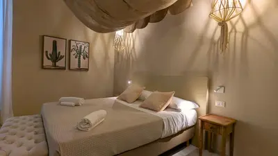 Letto o letti in una camera di PalazzoRusso Ortigia Suite & Apartments