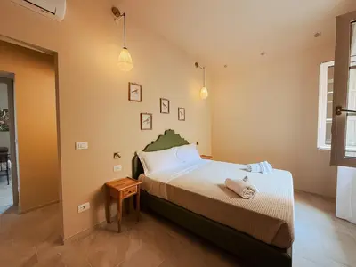 Letto o letti in una camera di PalazzoRusso Ortigia Suite & Apartments