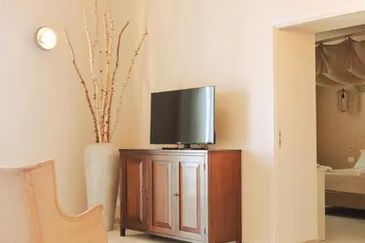 TV o dispositivi per l'intrattenimento presso PalazzoRusso Ortigia Suite & Apartments