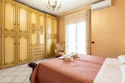 Letto o letti in una camera di GuestHost - Center Apartment Catania