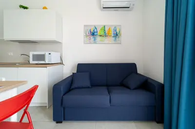 Area soggiorno di GuestHost - Borgo 84 Marzamemi - Le Vele Apt