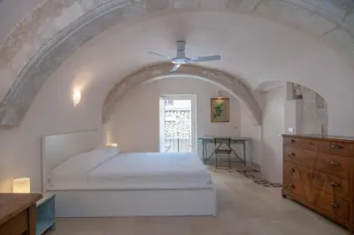Letto o letti in una camera di Palazzo Degli Olivi