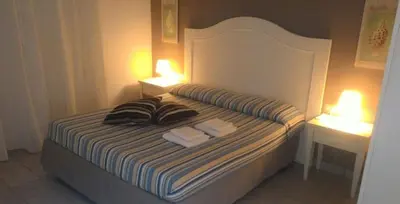 Letto o letti in una camera di Casa Aquatika Mediterranea Borgo Rio Favara