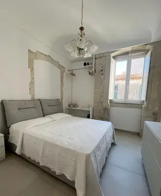 Letto o letti in una camera di Ambrogio House