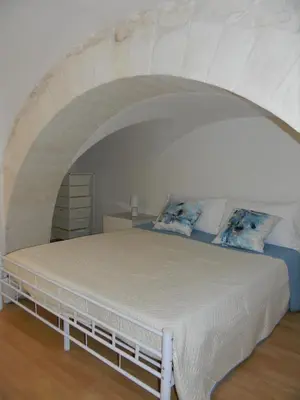 Letto o letti in una camera di Dammuso Rossini