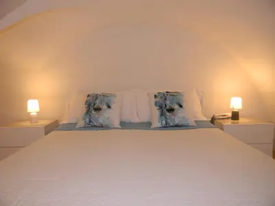 Letto o letti in una camera di Dammuso Rossini