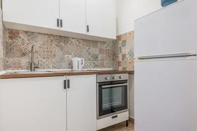 Cucina o angolo cottura di GuestHost - Storie di Lava e l'Angolo dell'Elefante Apartments
