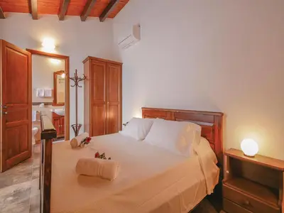 Letto o letti in una camera di Baglio Fasana whole property