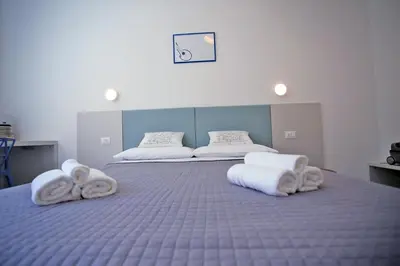 Letto o letti in una camera di Mandolino Apartment