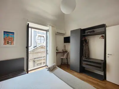 Letto o letti in una camera di Le Leggende di Casa Università