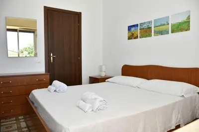 Letto o letti in una camera di Villa con piscina in Santa Maria del Focallo