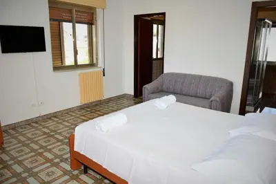 Letto o letti in una camera di Villa con piscina in Santa Maria del Focallo