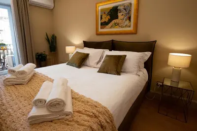 Letto o letti in una camera di Dimora Balcuni Gelosia