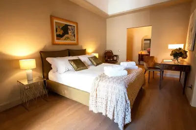Letto o letti in una camera di Dimora Balcuni Gelosia