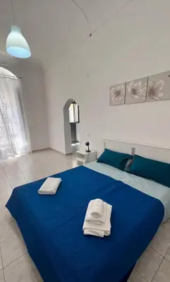 Letto o letti in una camera di Casa Amurusa