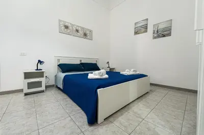 Letto o letti in una camera di Casa Amurusa