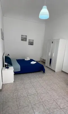 Letto o letti in una camera di Casa Amurusa