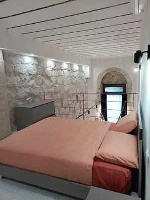 Letto o letti in una camera di Casa Giorgia
