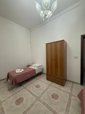 Letto o letti in una camera di Casa vacanze Paola