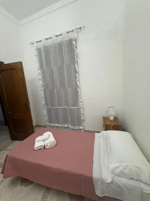 Letto o letti in una camera di Casa vacanze Paola