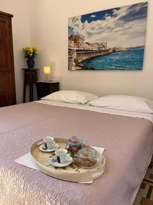 Letto o letti in una camera di Vista Ortigia