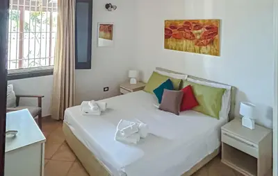 Letto o letti in una camera di Villa Rita