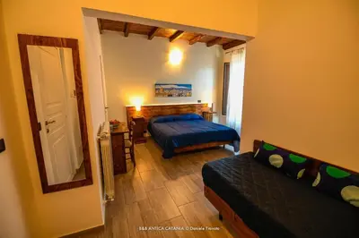 Letto o letti in una camera di Amica Catania