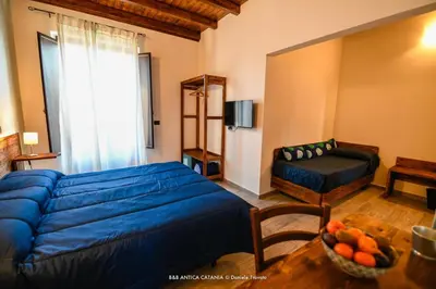 Letto o letti in una camera di Amica Catania