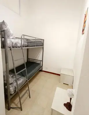 Letto o letti in una camera di Casa Anthea
