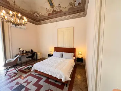 Letto o letti in una camera di Dimore del Plebiscito B&B