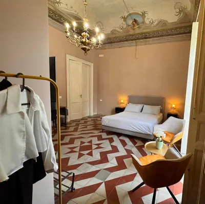Letto o letti in una camera di Dimore del Plebiscito B&B