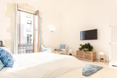 Letto o letti in una camera di Darsena Sunset Suites by Wonderful Italy