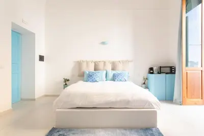 Letto o letti in una camera di Darsena Sunset Suites by Wonderful Italy