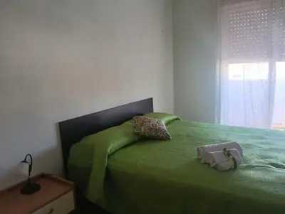 Letto o letti in una camera di casa vacanza luminosa fava