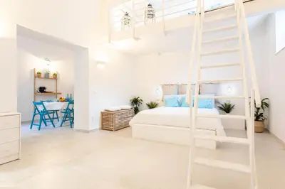 Letto o letti in una camera di Darsena Sunset Apartments by Wonderful Italy