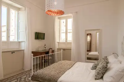 Letto o letti in una camera di B&B Novecento Siciliano