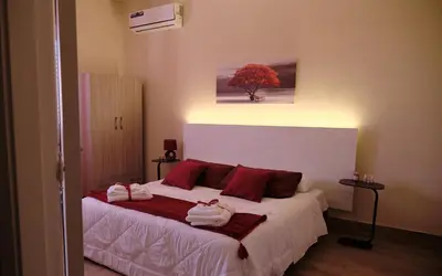 Letto o letti in una camera di B&B Faro di Luce