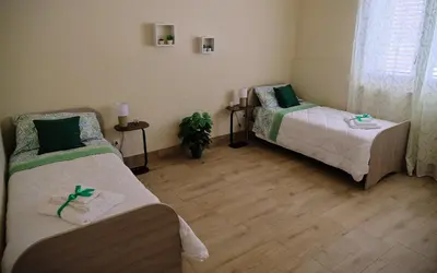 Letto o letti in una camera di B&B Faro di Luce