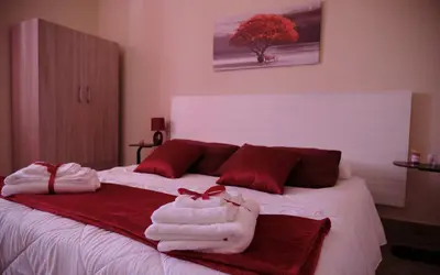 Letto o letti in una camera di B&B Faro di Luce