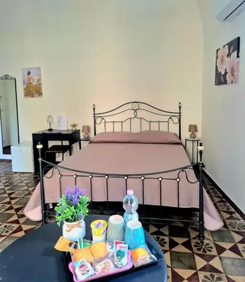 Letto o letti in una camera di Dolce Catania