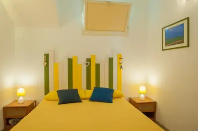 Letto o letti in una camera di Villa Margiu - Casa Ossino