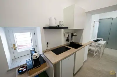 Cucina o angolo cottura di Nymphē Ortigia Apartments