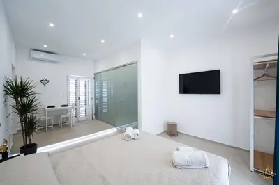 Letto o letti in una camera di Nymphē Ortigia Apartments