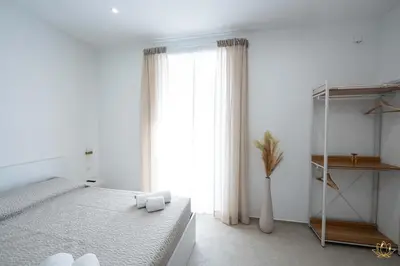 Letto o letti in una camera di Nymphē Ortigia Apartments