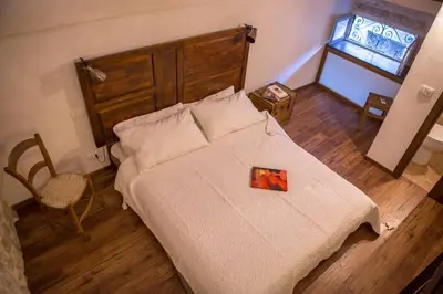 Letto o letti in una camera di Case-grotte degli Avi, esperienza abitativa in grotta