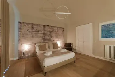 Letto o letti in una camera di Suite 1 - Palazzo Auteri