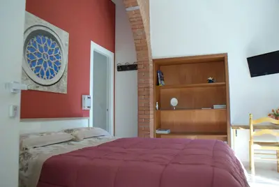 Letto o letti in una camera di Appartamento Astrea