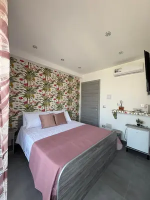 Letto o letti in una camera di Rooms La Playa